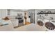 Bright kitchen with white cabinetry, stainless appliances, and convenient laundry area at 1910 Clubhouse Rd, Lakeland, FL 33813