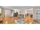Open-concept living room with hardwood floors and access to other rooms at 1910 Clubhouse Rd, Lakeland, FL 33813