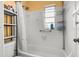 Clean white bathroom with a combined shower and tub at 1927 E Main St, Lakeland, FL 33801
