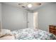 Simple bedroom with a ceiling fan and closet doors at 1927 E Main St, Lakeland, FL 33801