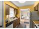 Traditional kitchen with wood cabinets and white appliances with eating space at 1927 E Main St, Lakeland, FL 33801