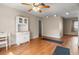 Living room with wood floors and white hutch with a desk to the side at 1927 E Main St, Lakeland, FL 33801