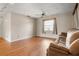 Bright living room features hardwood floors, a ceiling fan, and ample natural light at 1927 E Main St, Lakeland, FL 33801