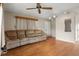 Comfortable living room featuring wood flooring, neutral paint, and a ceiling fan at 1927 E Main St, Lakeland, FL 33801