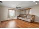 Bright living room with a large sofa, hardwood floors, and ample natural light at 1927 E Main St, Lakeland, FL 33801