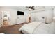 Bedroom featuring a plush bed and ample storage with white dressers, offering a comfortable and organized space at 2110 Bristol Ave, Lakeland, FL 33803