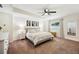 Inviting bedroom featuring a comfortable bed with soft linens, complemented by matching nightstands and neutral decor at 2110 Bristol Ave, Lakeland, FL 33803