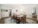 Bright dining room has wood floors, an area rug, and classic decor at 2110 Bristol Ave, Lakeland, FL 33803