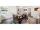Charming dining room is well-lit with wood floors, an area rug, and bright walls at 2110 Bristol Ave, Lakeland, FL 33803