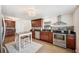 Modern kitchen showcases stainless steel appliances, an island, and beautiful granite countertops at 2110 Bristol Ave, Lakeland, FL 33803