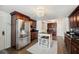 Bright eat-in kitchen featuring stainless steel appliances, an island, and modern lighting at 2110 Bristol Ave, Lakeland, FL 33803