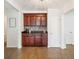 Kitchen area with dark cabinets, granite countertops, and mosaic tile backsplash at 2110 Bristol Ave, Lakeland, FL 33803