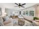 Bright living room with modern furniture, large windows, hardwood floors, and stylish decor at 2110 Bristol Ave, Lakeland, FL 33803