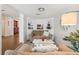 Cozy living area with built-in shelving and a view to the adjacent kitchen at 2110 Bristol Ave, Lakeland, FL 33803