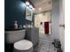 Stylish bathroom with modern fixtures, patterned flooring, and a shower with glass doors at 2424 Bates Sw Ave, Winter Haven, FL 33880