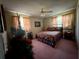 Bedroom with ceiling fan and two windows at 2424 Bates Sw Ave, Winter Haven, FL 33880