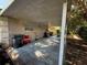 Spacious carport with storage options and access to the home's backyard at 2424 Bates Sw Ave, Winter Haven, FL 33880
