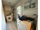 Laundry room with stacked washer and dryer, and a utility sink at 2424 Bates Sw Ave, Winter Haven, FL 33880