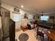 Living room with tile floor and door to outside at 2424 Bates Sw Ave, Winter Haven, FL 33880