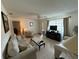 Spacious living room featuring neutral color scheme and plenty of comfortable seating options at 2424 Bates Sw Ave, Winter Haven, FL 33880