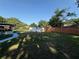 Backyard features a shed with painted exterior and a blue walkway at 2424 Bates Sw Ave, Winter Haven, FL 33880