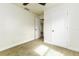 Cozy bedroom with neutral carpet, white trim, and a closet for storage at 2711 Crutchfield Rd, Lakeland, FL 33805