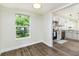 Dining room adjacent to the kitchen with hardwood floors and stainless steel appliances at 2711 Crutchfield Rd, Lakeland, FL 33805