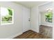 Entryway featuring hardwood floors, a white door, and a view to the bedroom at 2711 Crutchfield Rd, Lakeland, FL 33805