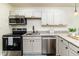 Modern kitchen with granite countertops, stainless steel appliances, and plenty of storage at 2711 Crutchfield Rd, Lakeland, FL 33805