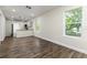 Open-concept living room and kitchen featuring hardwood floors and modern finishes at 2711 Crutchfield Rd, Lakeland, FL 33805