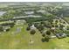 Spacious lot with beautiful trees, featuring a barn and a home with an inviting pool at 2911 Walker Rd, Lakeland, FL 33810