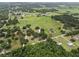 Acreage featuring a home with a pool and barn with fenced area at 2911 Walker Rd, Lakeland, FL 33810