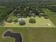 Large lot with home, pool and barn, surrounded by lush greenery at 2911 Walker Rd, Lakeland, FL 33810