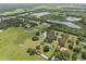 Aerial view of a home on a large lot with ponds nearby at 2911 Walker Rd, Lakeland, FL 33810