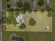 Spacious lot featuring a home, pool, barn, and pond at 2911 Walker Rd, Lakeland, FL 33810