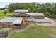 Large lot featuring a barn with fenced area, pool with white privacy fence, and screened porch at 2911 Walker Rd, Lakeland, FL 33810