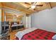 Bedroom features natural light, wood floors, closet mirror doors, and a ceiling fan at 2911 Walker Rd, Lakeland, FL 33810