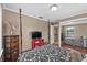 Bedroom with hardwood floors, a four poster bed, dresser, and sliding door mirrored closet at 2911 Walker Rd, Lakeland, FL 33810