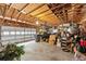 Garage with an open rafter ceiling, and storage space at 2911 Walker Rd, Lakeland, FL 33810