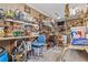 Garage interior with tools and supplies stored on shelves and a workbench at 2911 Walker Rd, Lakeland, FL 33810