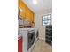 Functional laundry room features a washer, dryer, and extra storage space at 2911 Walker Rd, Lakeland, FL 33810