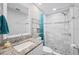 Modern bathroom featuring a marble-tiled shower, granite vanity, and updated fixtures at 3080 Cross Fox Dr, Mulberry, FL 33860