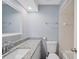 Bathroom features a granite countertop vanity, a toilet, and a large mirror at 3080 Cross Fox Dr, Mulberry, FL 33860