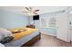 Relaxing bedroom with natural light and ceiling fan, offering a peaceful retreat at 3080 Cross Fox Dr, Mulberry, FL 33860