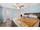 Spacious bedroom boasts natural light, ceiling fan, and an attached ensuite bathroom at 3080 Cross Fox Dr, Mulberry, FL 33860