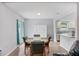 Bright dining area connecting to the kitchen, perfect for meals and entertaining, next to French doors to the backyard at 3080 Cross Fox Dr, Mulberry, FL 33860