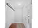 Clean entryway features wood-look flooring, coat rack, and door with sidelight at 3080 Cross Fox Dr, Mulberry, FL 33860