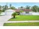 Charming single-story home with a well-manicured lawn and an attached two-car garage at 3080 Cross Fox Dr, Mulberry, FL 33860