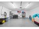 Large garage has a laundry area and space for storage at 3080 Cross Fox Dr, Mulberry, FL 33860