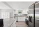 Newly updated kitchen featuring white cabinets, granite countertops and stainless steel appliances at 3080 Cross Fox Dr, Mulberry, FL 33860